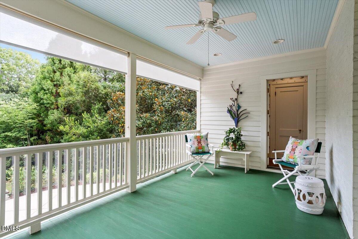 1128 Harvey Street Raleigh, NC 27608 - Photo 20 of 41 a living room with furniture and a floor to ceiling window
