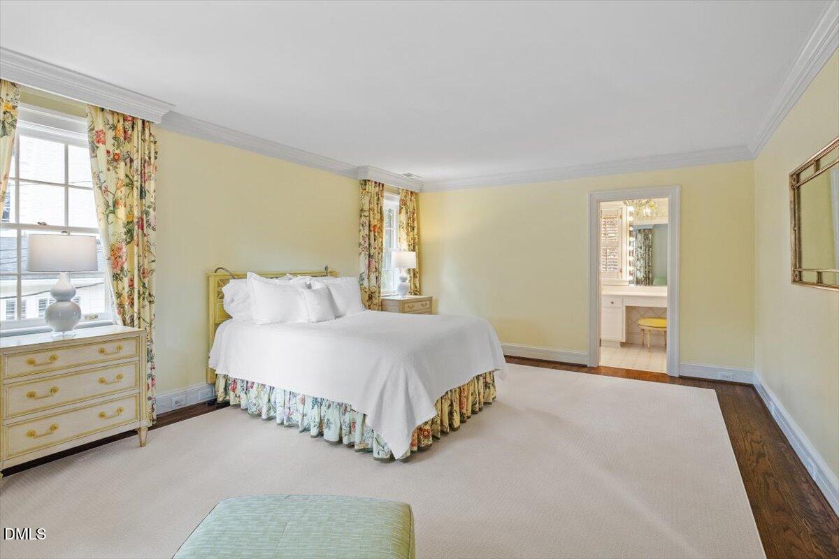 1128 Harvey Street Raleigh, NC 27608 - Photo 25 of 41 a spacious bedroom with a bed and window