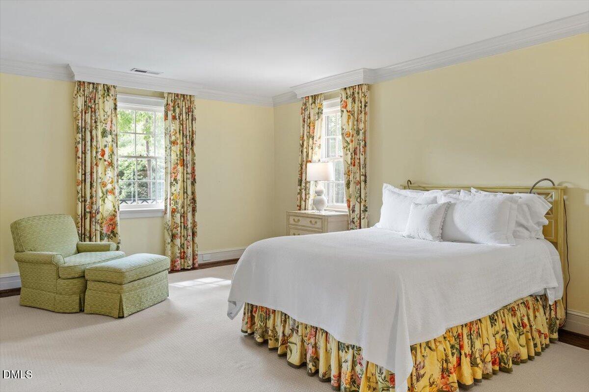 1128 Harvey Street Raleigh, NC 27608 - Photo 26 of 41 a bedroom with a bed and a couch