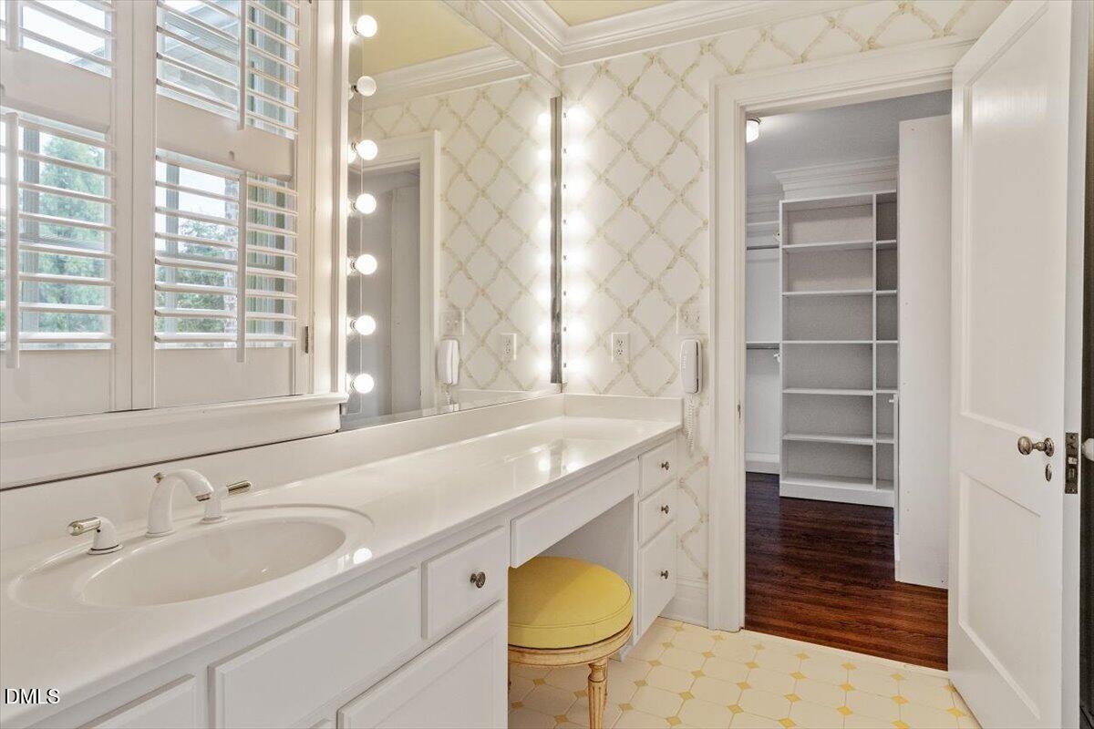 1128 Harvey Street Raleigh, NC 27608 - Photo 28 of 41 a bathroom with a granite countertop sink a toilet and shower