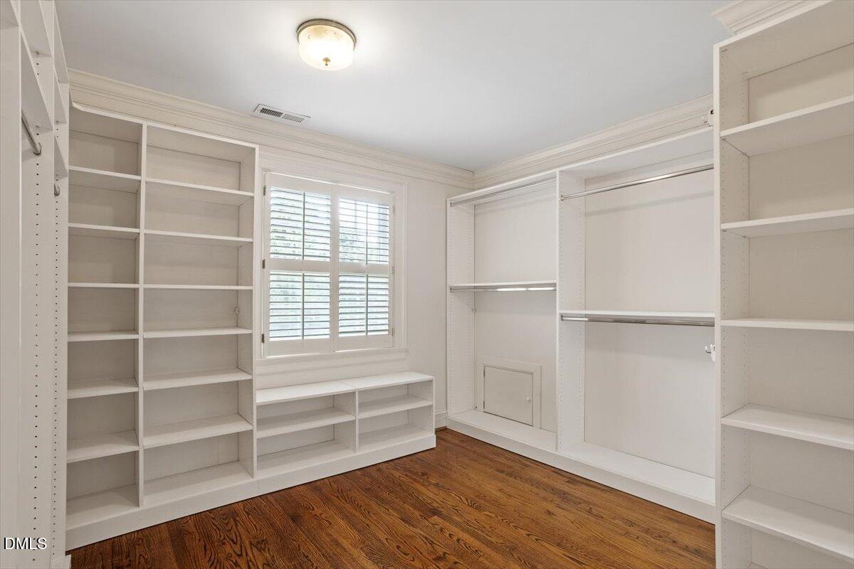 1128 Harvey Street Raleigh, NC 27608 - Photo 29 of 41 a view of walk in closet with empty racks