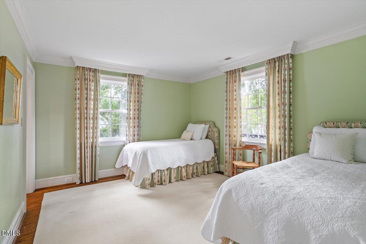 1128 Harvey Street Raleigh, NC 27608 - Photo 30 of 41 a bedroom with two beds and a large window