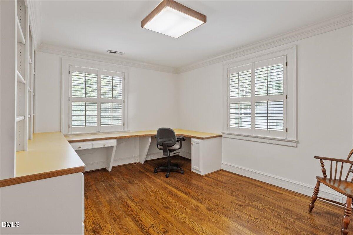 1128 Harvey Street Raleigh, NC 27608 - Photo 32 of 41 a workspace with furniture and a window