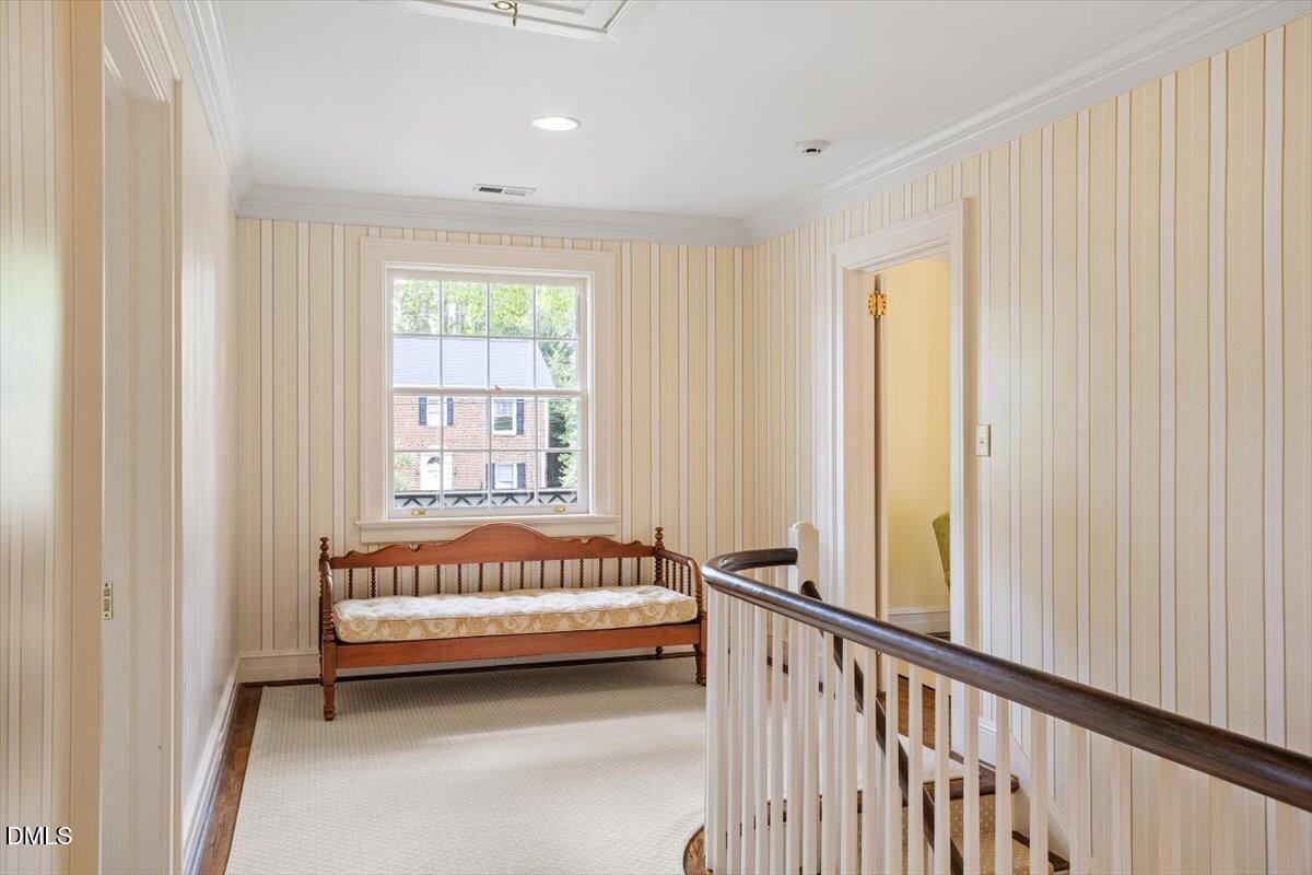1128 Harvey Street Raleigh, NC 27608 - Photo 33 of 41 a spacious bedroom with a bed and a window