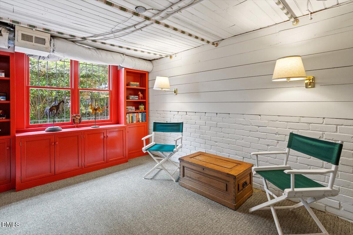 1128 Harvey Street Raleigh, NC 27608 - Photo 35 of 41 a backyard of a house with a couch and chairs