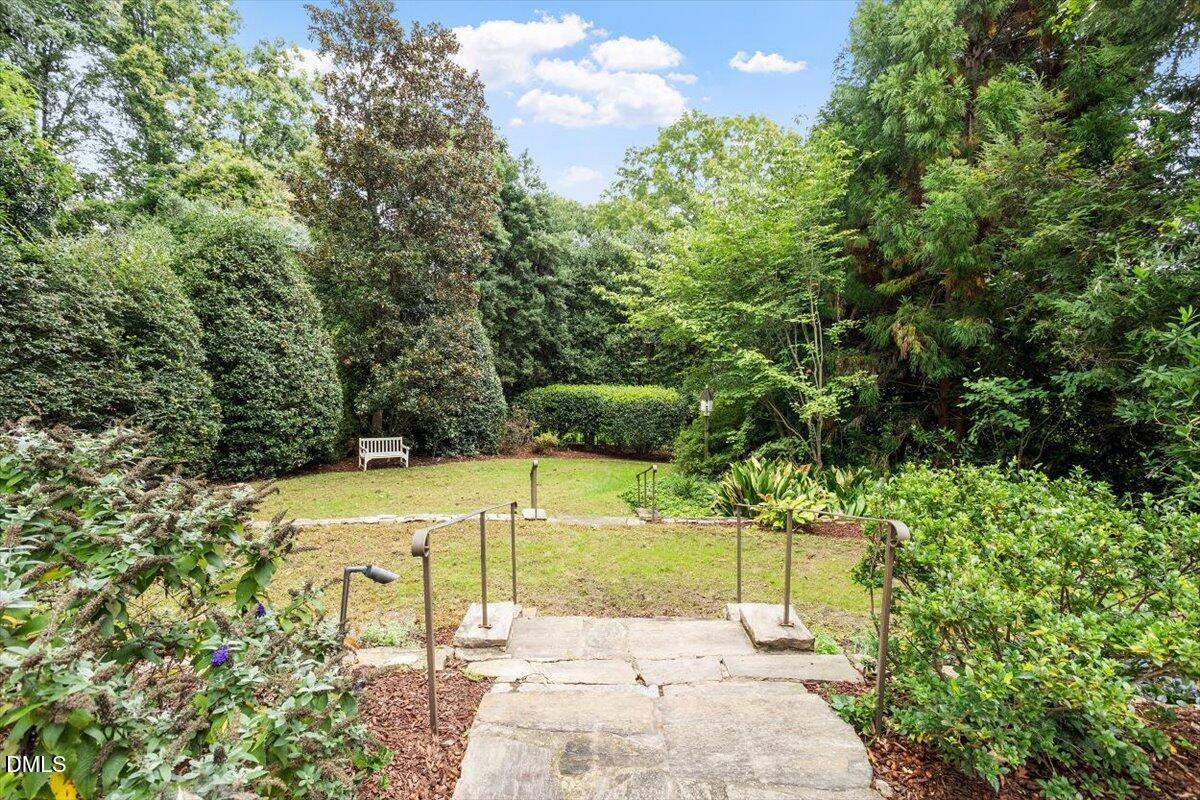 1128 Harvey Street Raleigh, NC 27608 - Photo 39 of 41 a view of a garden with an outdoor space