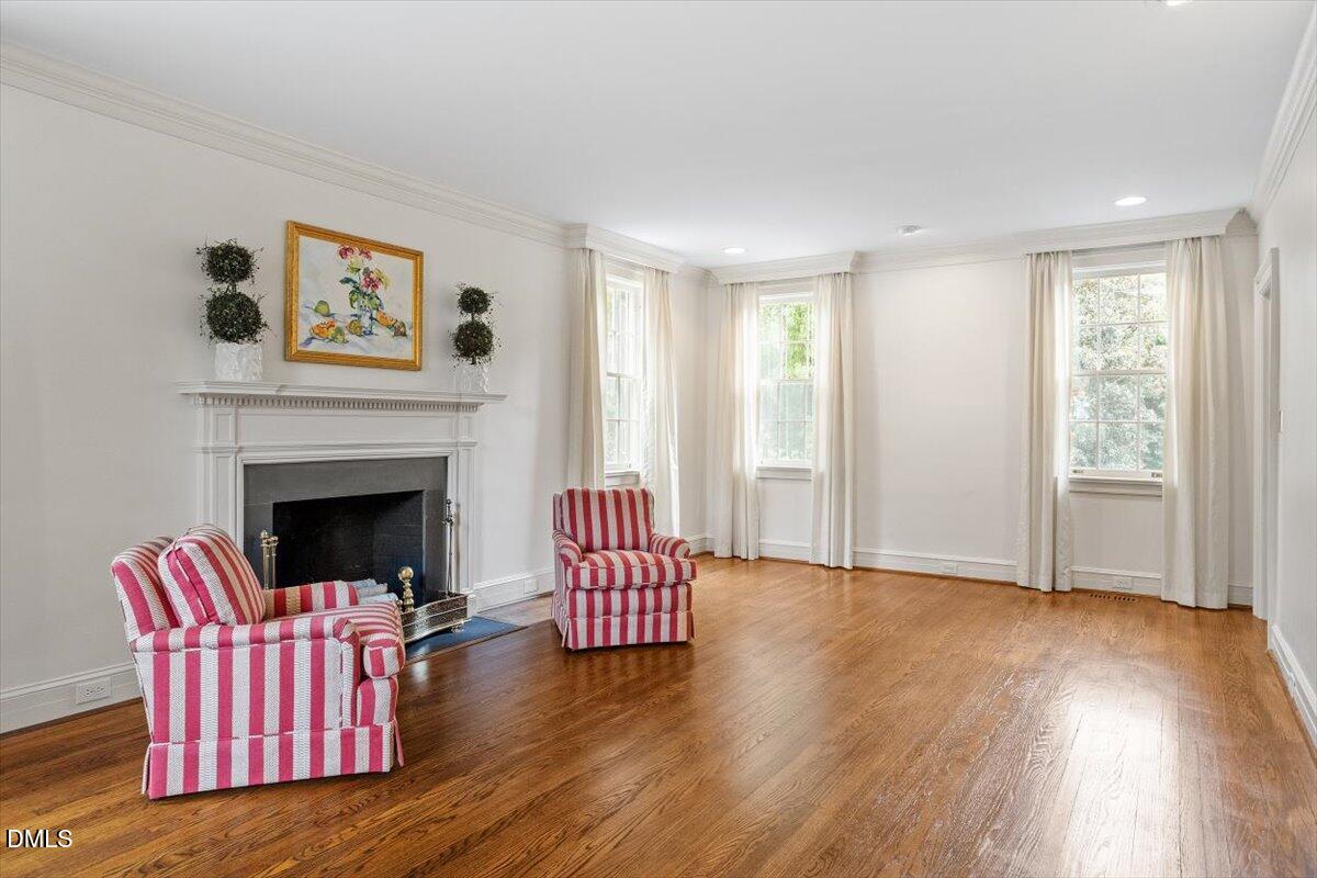 1128 Harvey Street Raleigh, NC 27608 - Photo 7 of 41 a living room with furniture and a fireplace