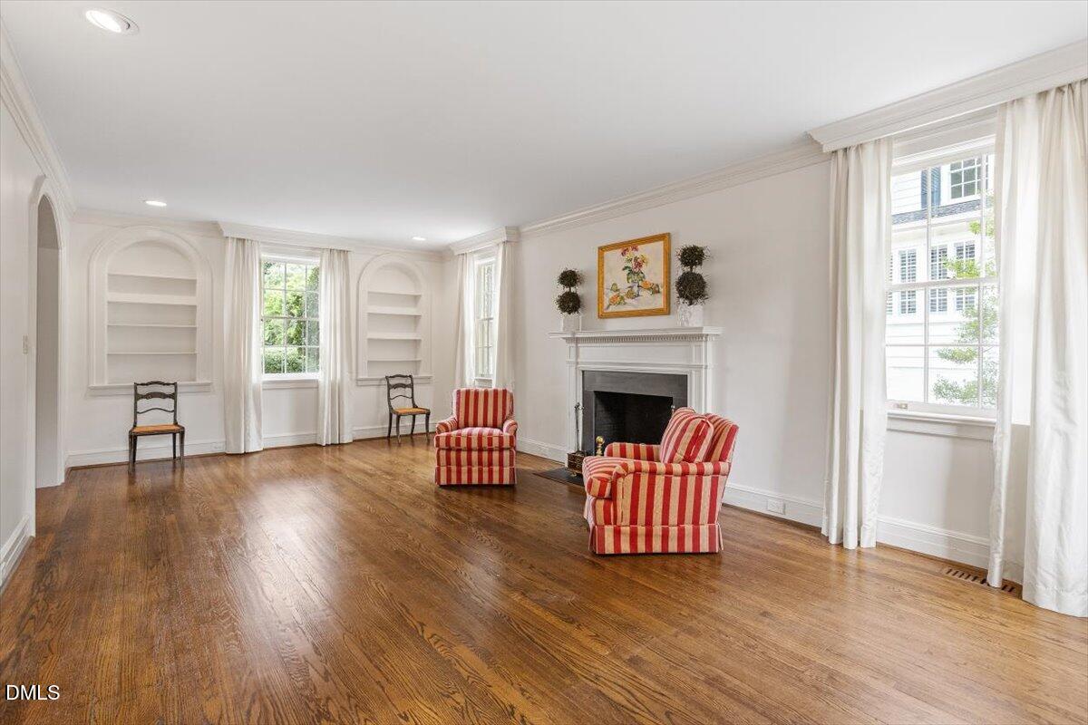 1128 Harvey Street Raleigh, NC 27608 - Photo 8 of 41 a living room with furniture and a fireplace