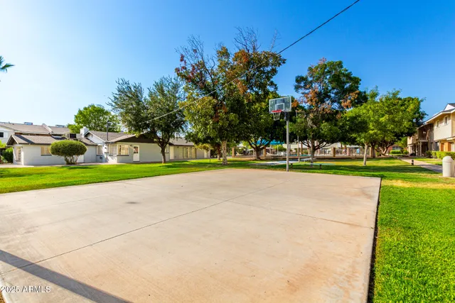 a view of a swimming pool with a yard