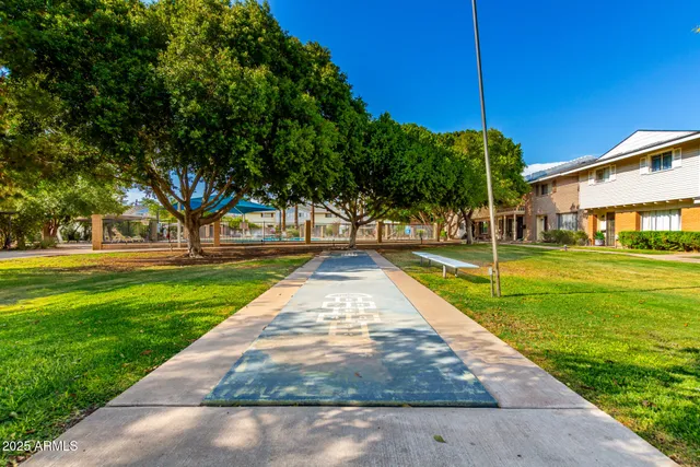 a view of a swimming pool with a patio