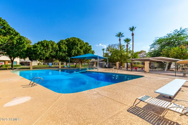 a view of a swimming pool with sitting area