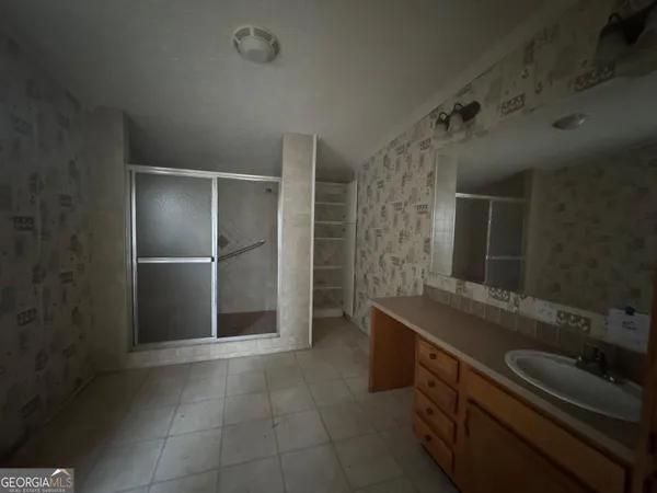 a bathroom with a double vanity sink a and mirror