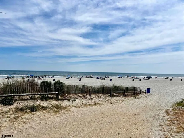 a view of a building with wooden fence