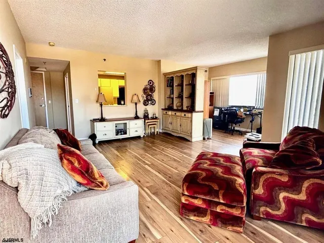 a living room with blue lights with furniture