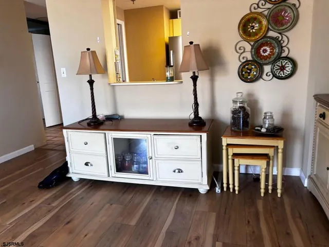 a kitchen with a stove and white cabinets