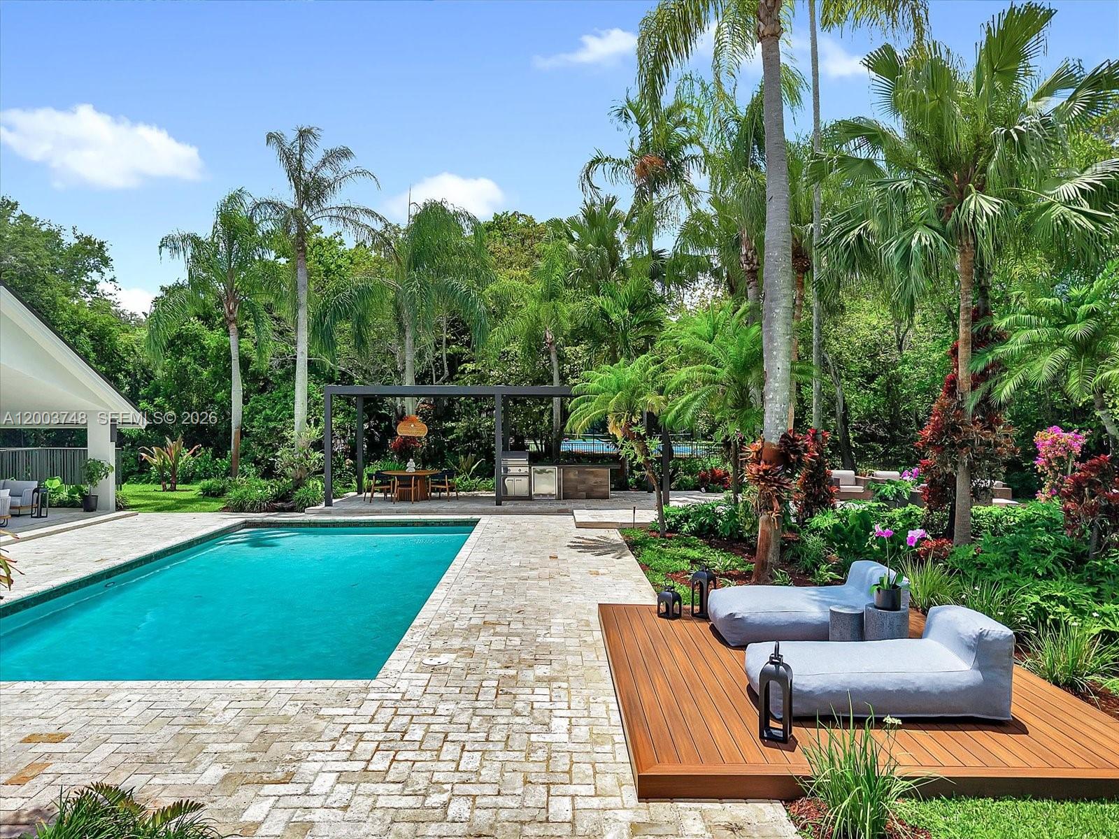 2675 Hackney Road Weston, FL 33331 - Photo 35 of 61 a view of a patio with couches and a table and chairs with plants and trees