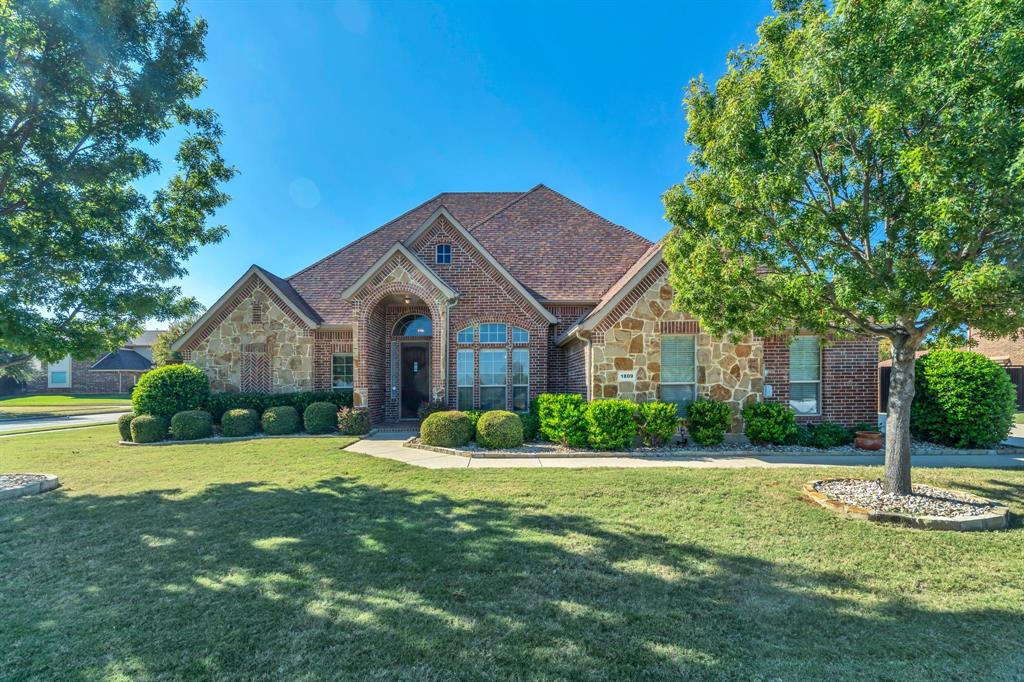1809 Monaco Drive Corinth, TX 76210 - Photo 1 of 1 a front view of a house with garden