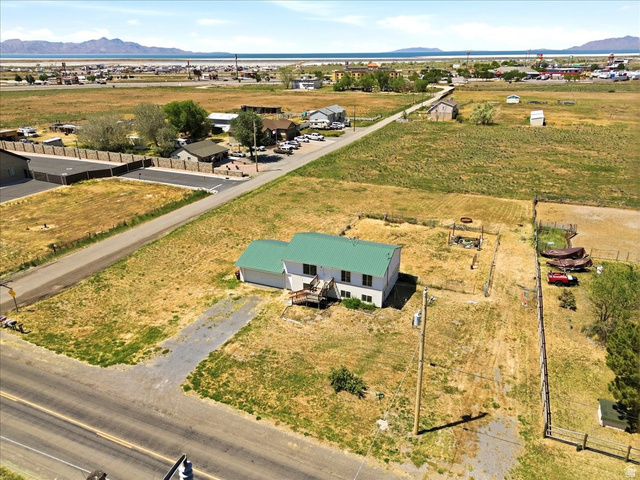 1613 Sunset Road Lake Point, UT 84074 - Photo 31 of 33 Split-level residence featuring a green metal roof and an attached garage