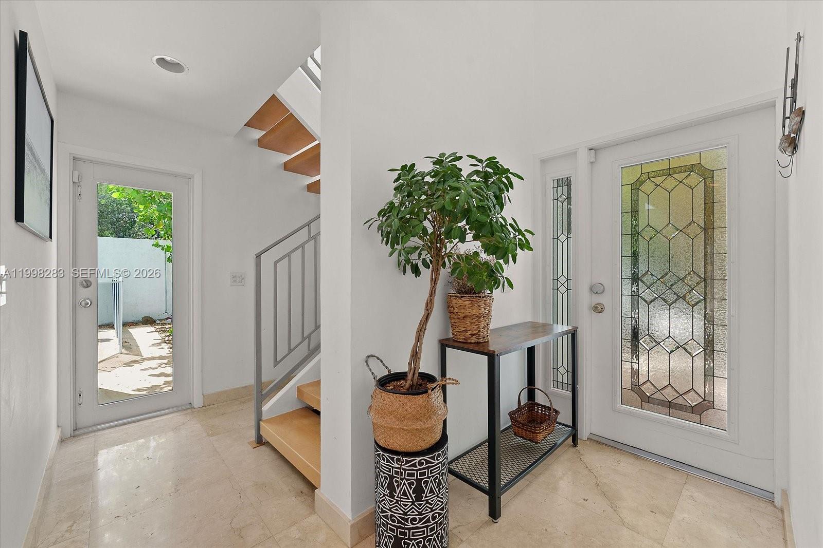 2721 Southwest 22nd Avenue, Unit A Miami, FL 33133 - Photo 20 of 36 a room with furniture and a potted plant