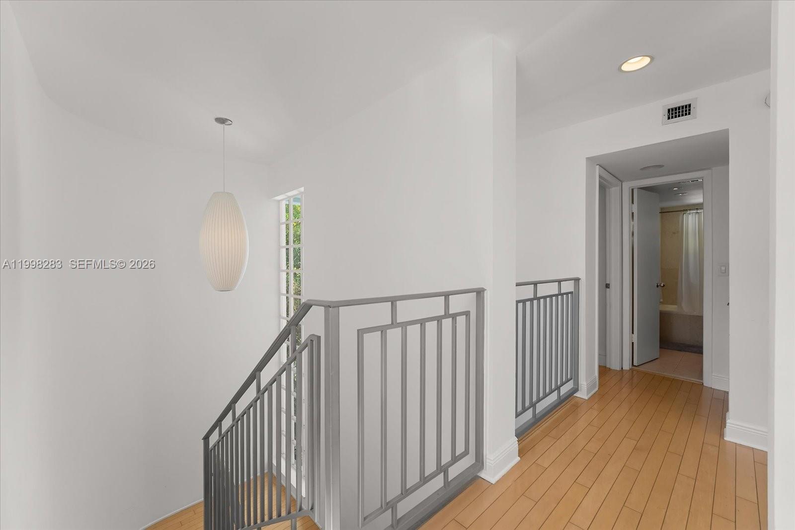 2721 Southwest 22nd Avenue, Unit A Miami, FL 33133 - Photo 21 of 36 a view of hallway with wooden floor