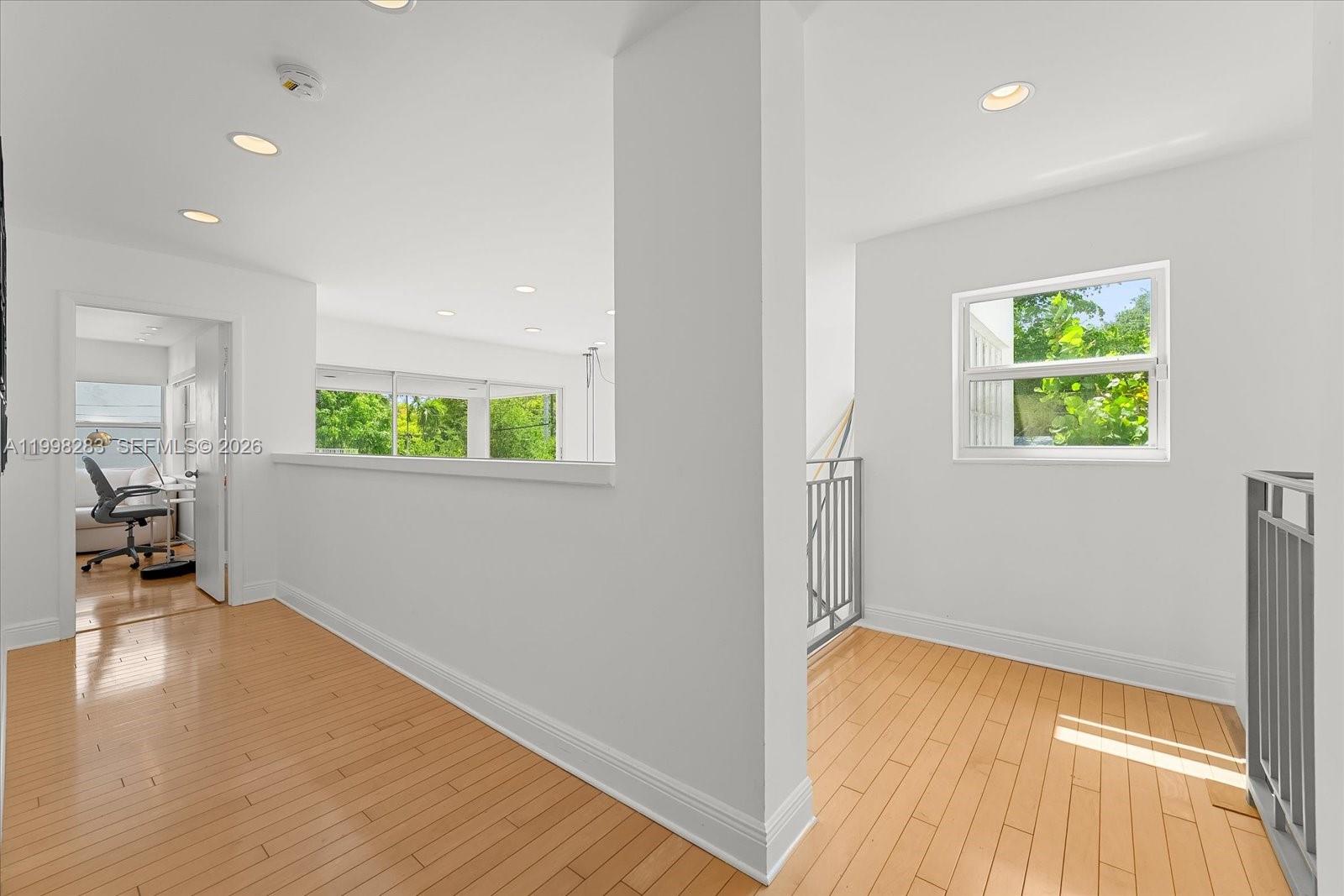 2721 Southwest 22nd Avenue, Unit A Miami, FL 33133 - Photo 22 of 36 wooden floor in an empty room with a window