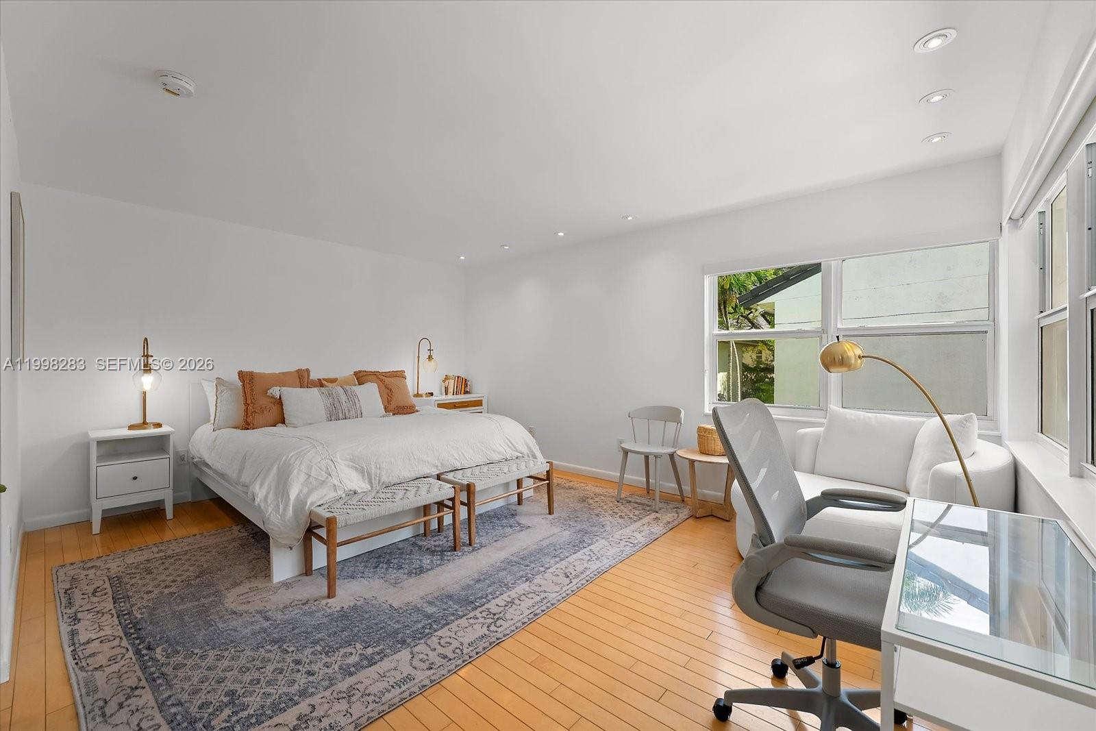 2721 Southwest 22nd Avenue, Unit A Miami, FL 33133 - Photo 23 of 36 a bed room with a bed and chair