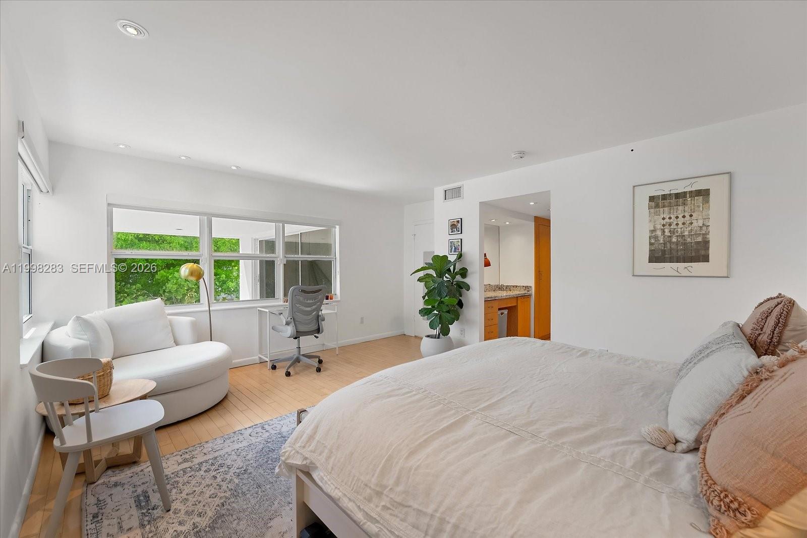 2721 Southwest 22nd Avenue, Unit A Miami, FL 33133 - Photo 24 of 36 a living room with furniture and a large window