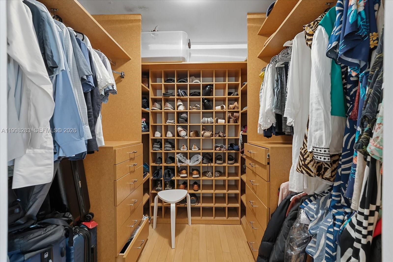 2721 Southwest 22nd Avenue, Unit A Miami, FL 33133 - Photo 26 of 36 a view of walk in closet with clothes and shoes