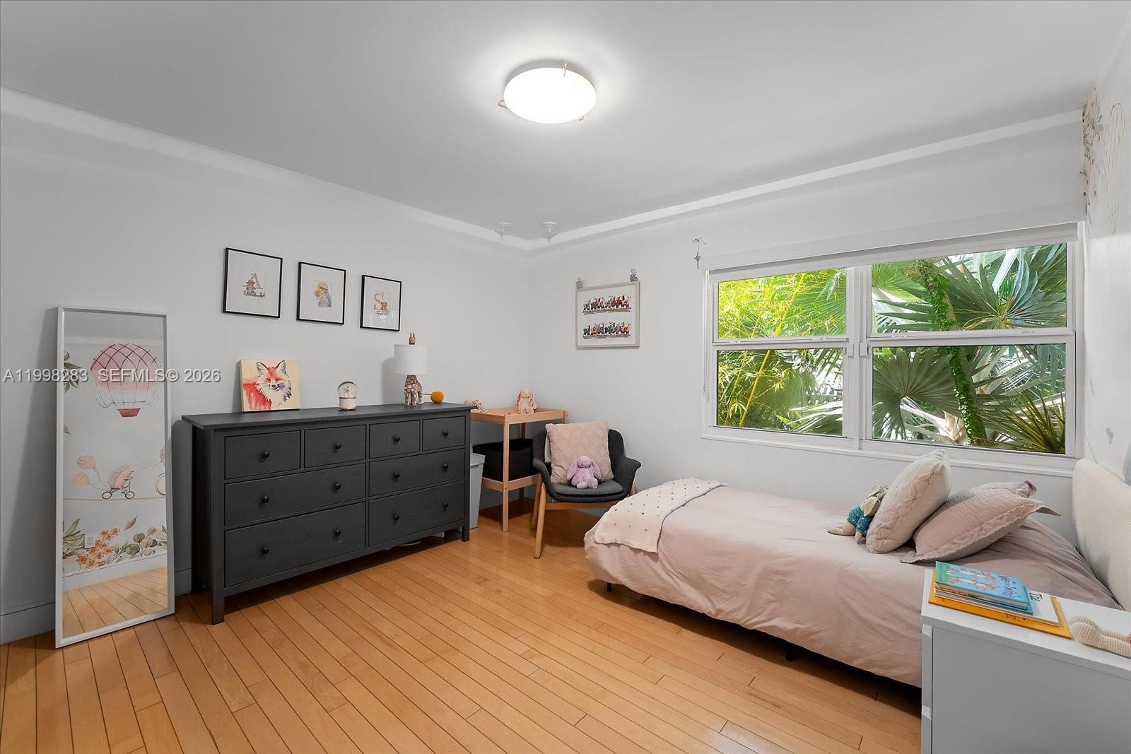 2721 Southwest 22nd Avenue, Unit A Miami, FL 33133 - Photo 30 of 36 a bedroom with furniture and a window