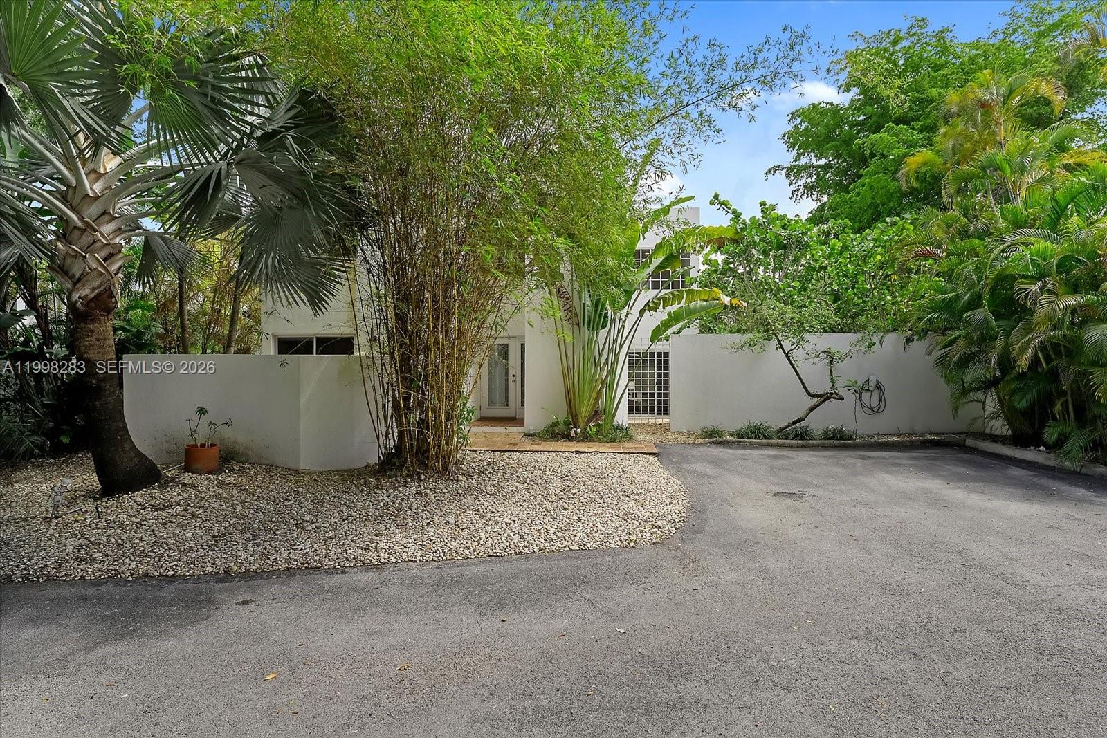2721 Southwest 22nd Avenue, Unit A Miami, FL 33133 - Photo 34 of 36 a view of a house with a tree