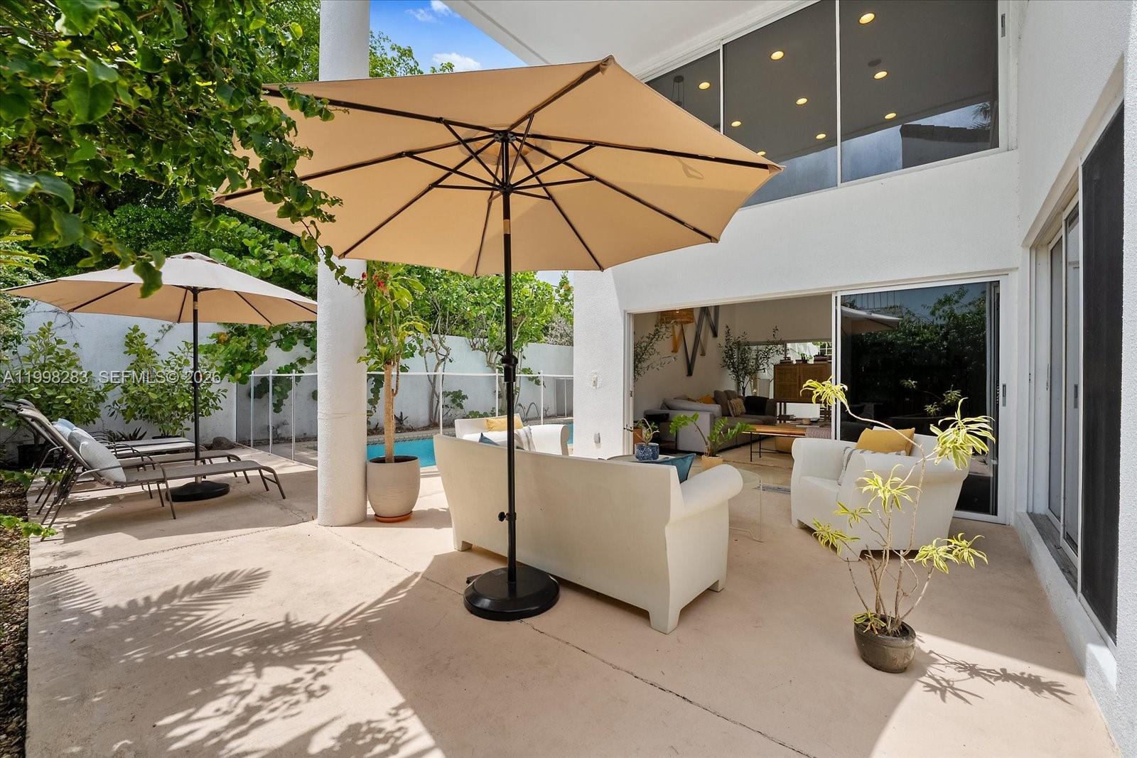 2721 Southwest 22nd Avenue, Unit A Miami, FL 33133 - Photo 4 of 36 a view of a patio with couches and potted plants