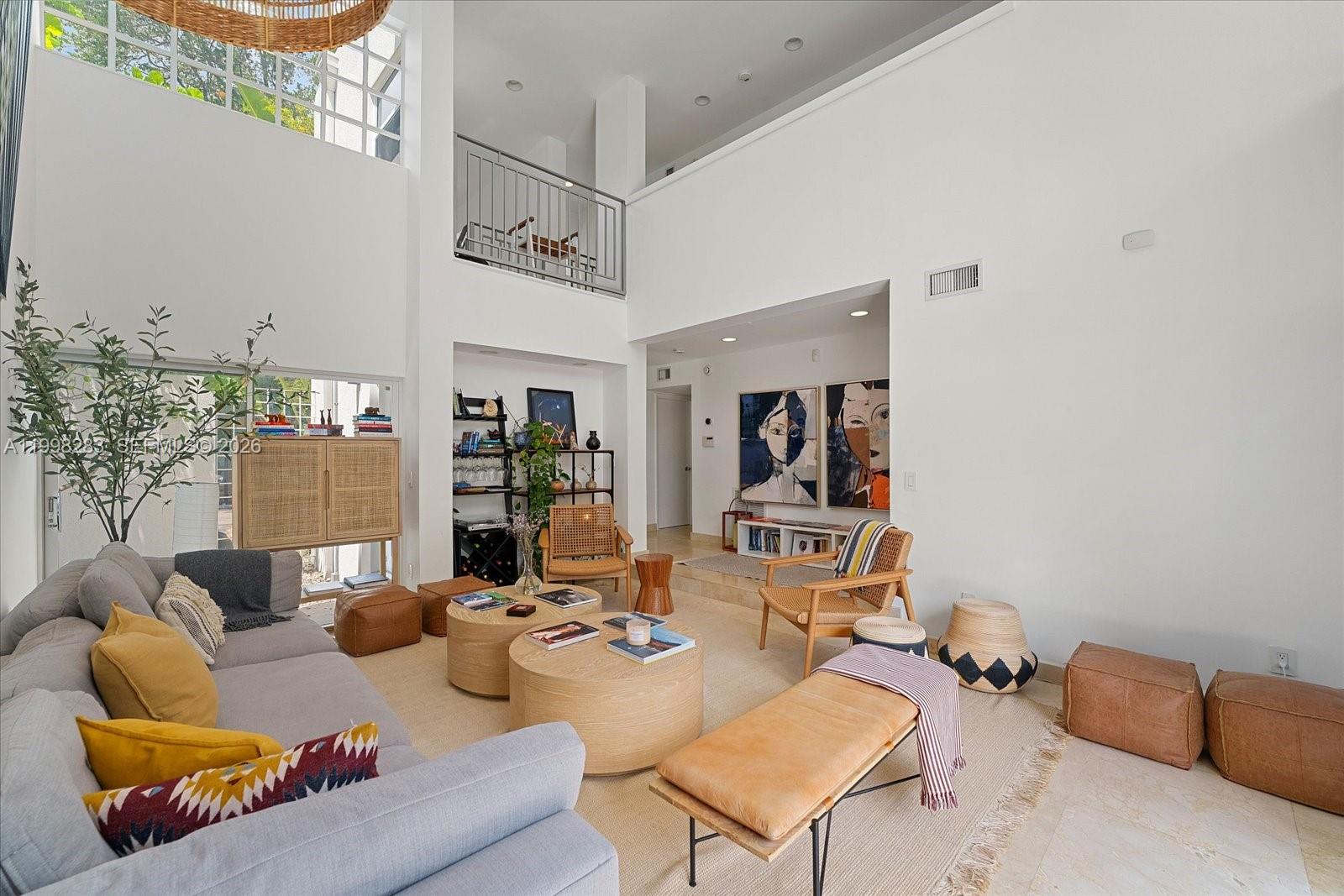 2721 Southwest 22nd Avenue, Unit A Miami, FL 33133 - Photo 9 of 36 a living room with furniture and wooden floor