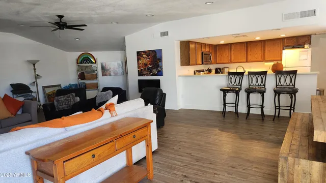 a room with furniture and wooden floor