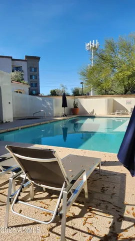 a view of a swimming pool with a patio