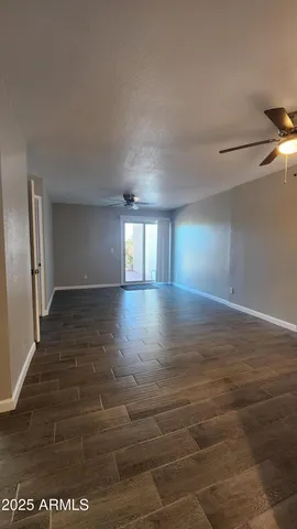 a view of livingroom with hardwood floor and hallway
