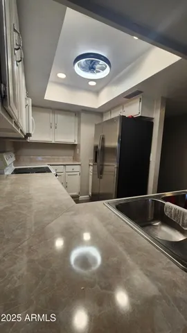a kitchen with stainless steel appliances a refrigerator and a sink