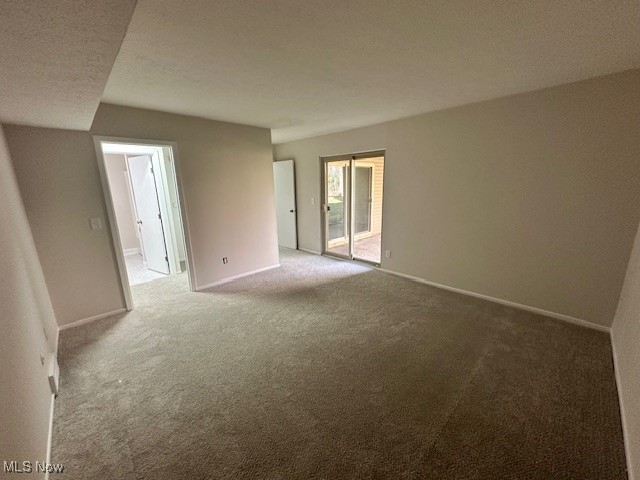 16575 Wren Road, Unit 3F Chagrin Falls, OH 44023 - Photo 9 of 14 Carpeted spare room with a textured ceiling
