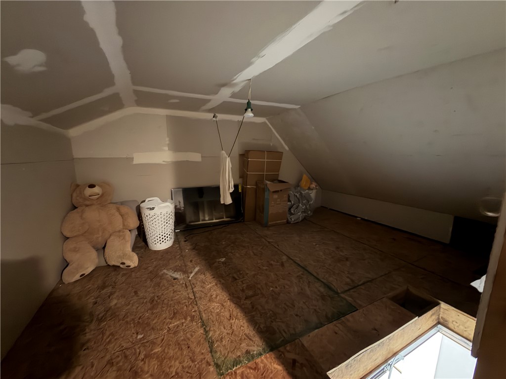 302 Sirrine Street Honea Path, SC 29654 - Photo 20 of 24 An unfinished attic space presents a blank canvas for future customization and additional living area.