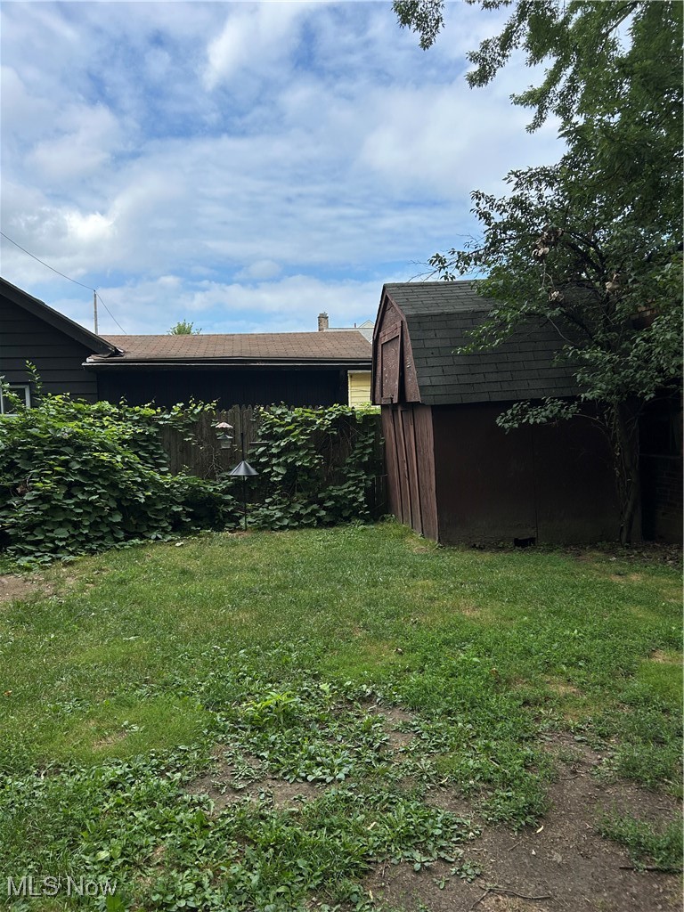 11406 Bellaire Road Cleveland, OH 44111 - Photo 24 of 28 View of grassy yard featuring a shed