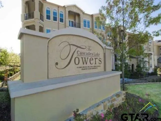 a living room with furniture ceiling fan and a rug