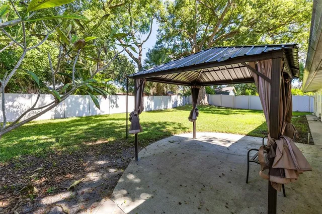 a view of a swimming pool with a backyard