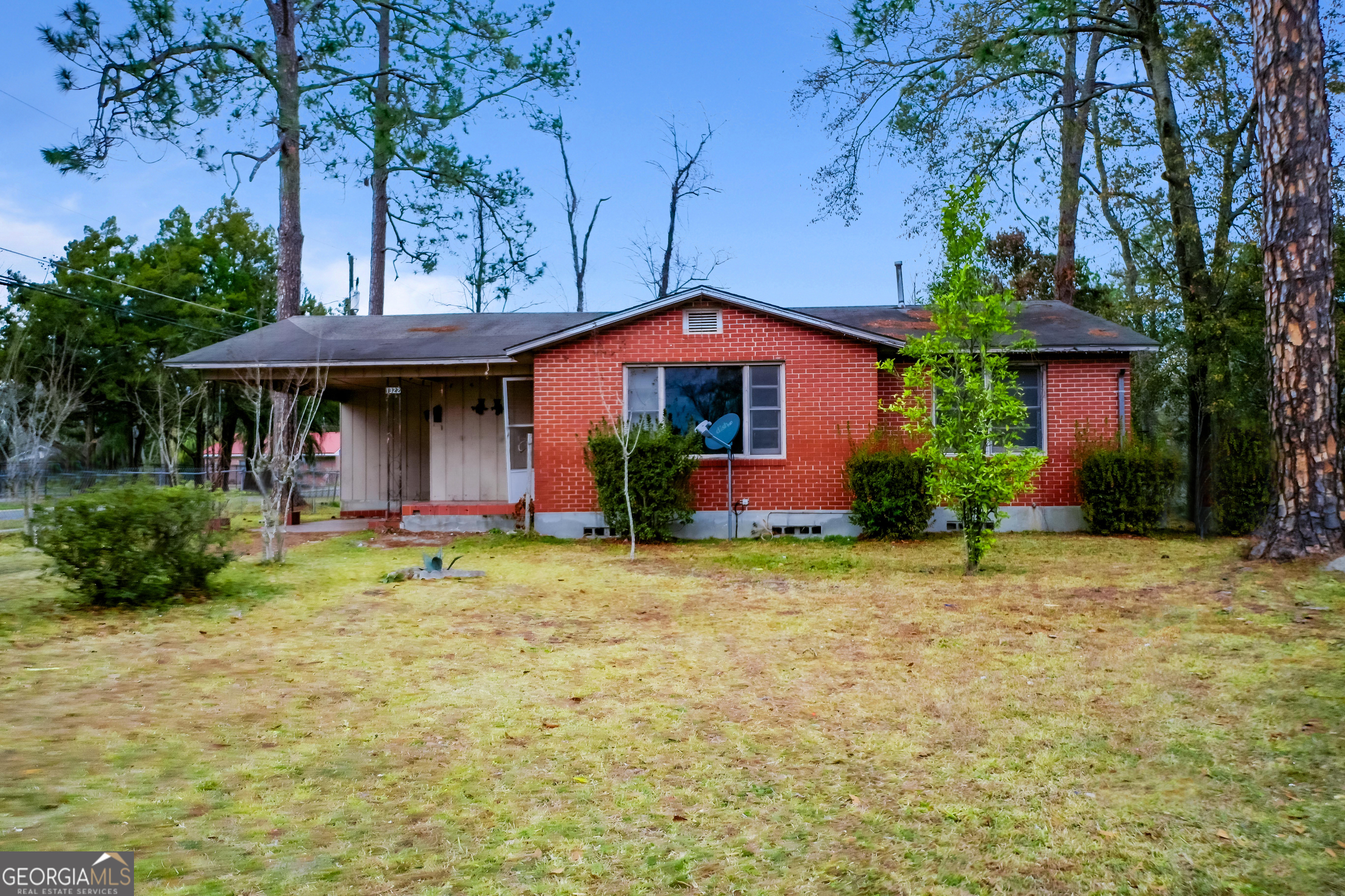 1322 Jane Street Waycross, GA 31503 - Photo 1 of 1 a front view of a house with garden