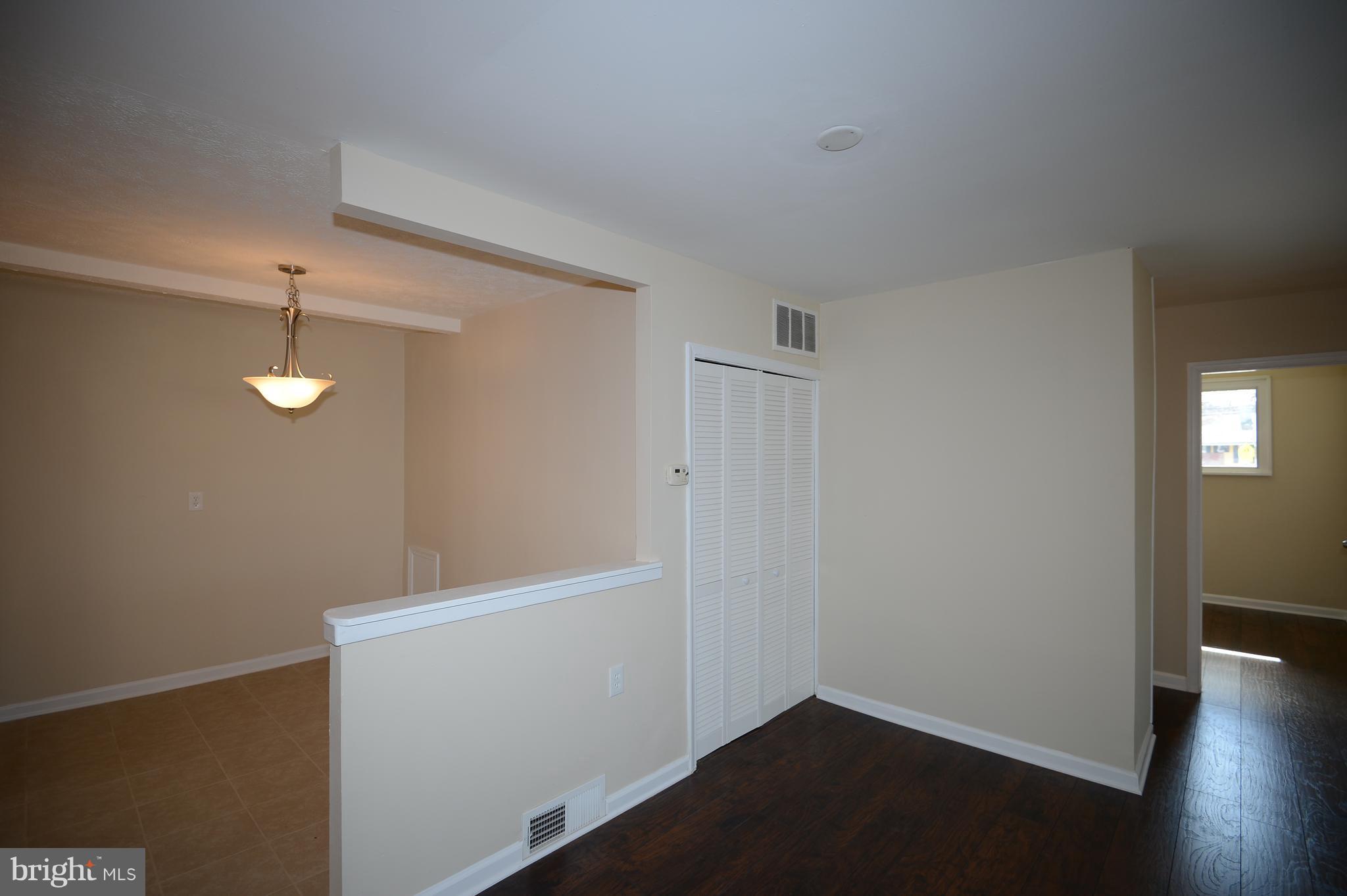 7500 Greenleaf Road Landover, MD 20785 - Photo 14 of 22 wooden floor in an empty room