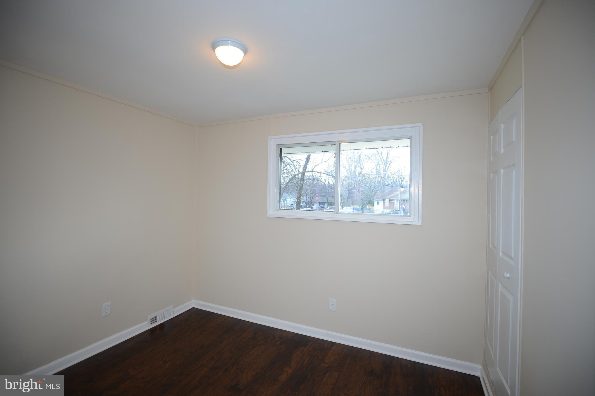 7500 Greenleaf Road Landover, MD 20785 - Photo 17 of 22 an empty room with a window