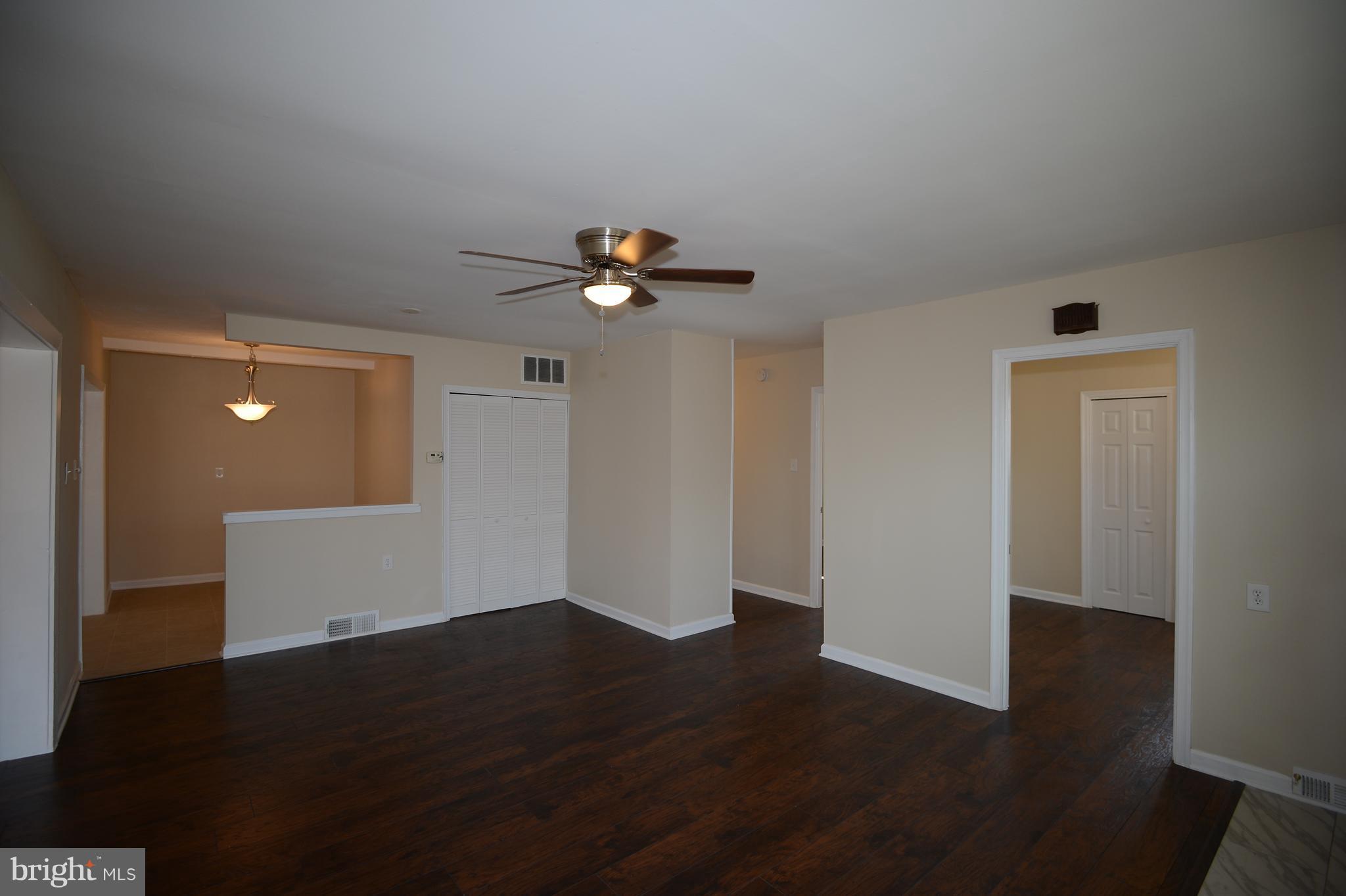 7500 Greenleaf Road Landover, MD 20785 - Photo 4 of 22 a view of an empty room with wooden floor