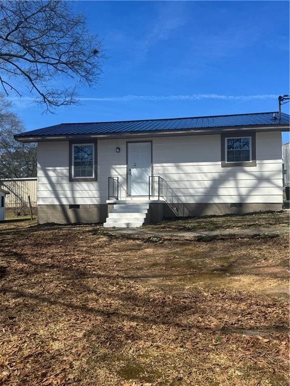 42 Busha Street Toccoa, GA 30577 - Photo 1 of 12 a kitchen with kitchen island a stove and a refrigerator