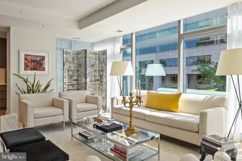 a kitchen with stainless steel appliances a stove and cabinets