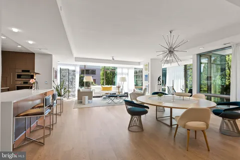 a kitchen with stainless steel appliances a sink a stove and a refrigerator