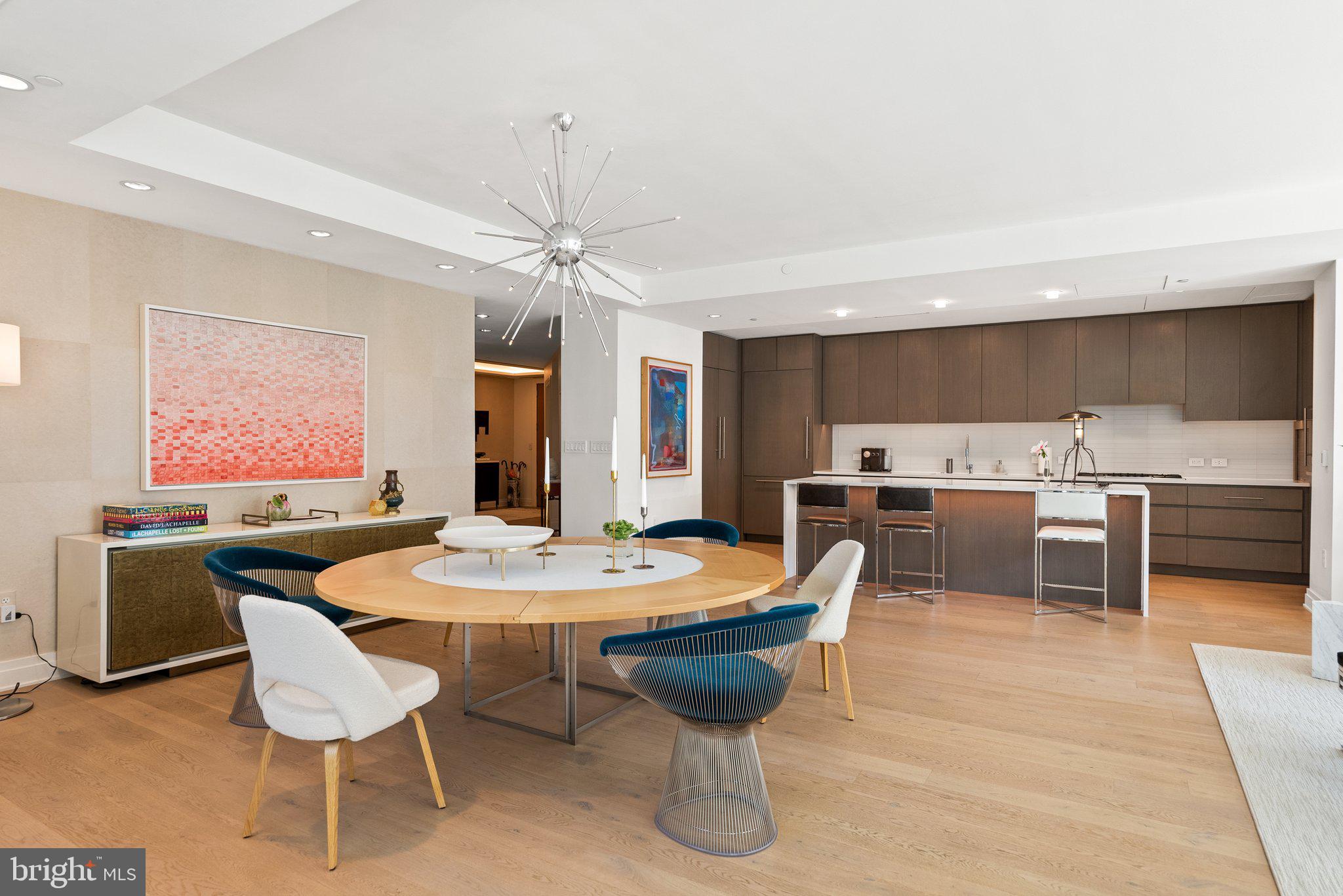 2501 M Street Northwest, Unit 203 Washington, DC 20037 - Photo 20 of 81 a dining room with a table chairs and a dining table