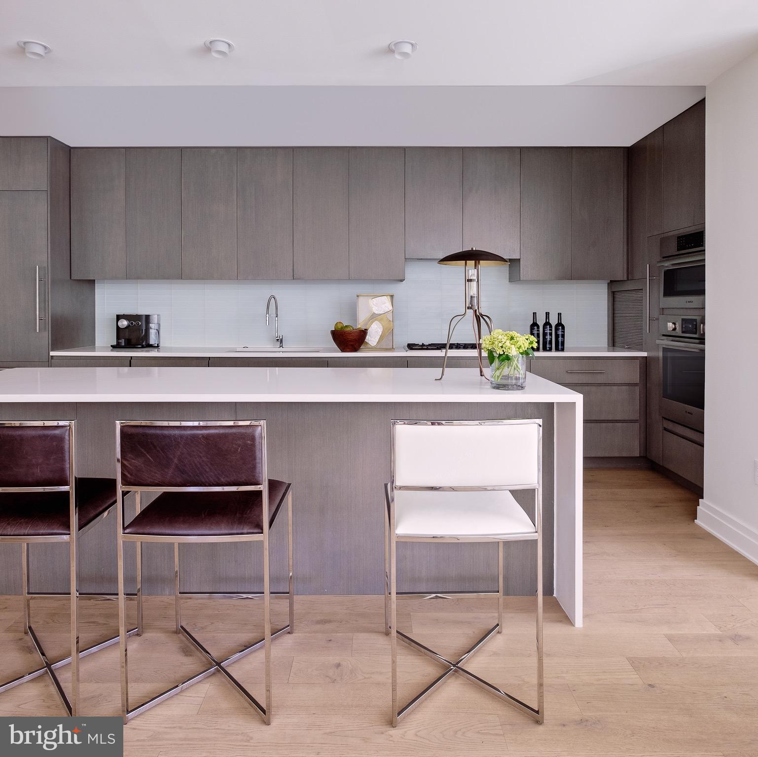 2501 M Street Northwest, Unit 203 Washington, DC 20037 - Photo 22 of 81 a kitchen with stainless steel appliances a stove and cabinets